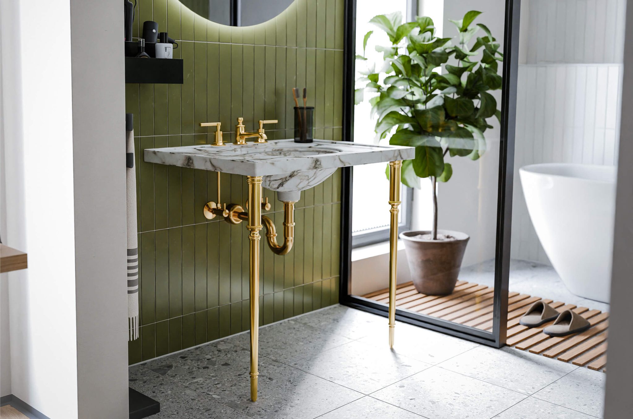 Embry legs in green tiled bathroom, polished brass finish