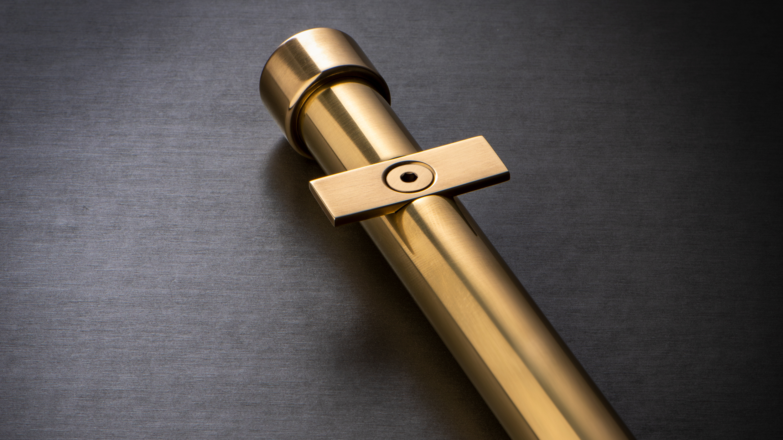 Close up of shelf tabs, a brass component option for shelving if the glass needs to meet in the middle of the return